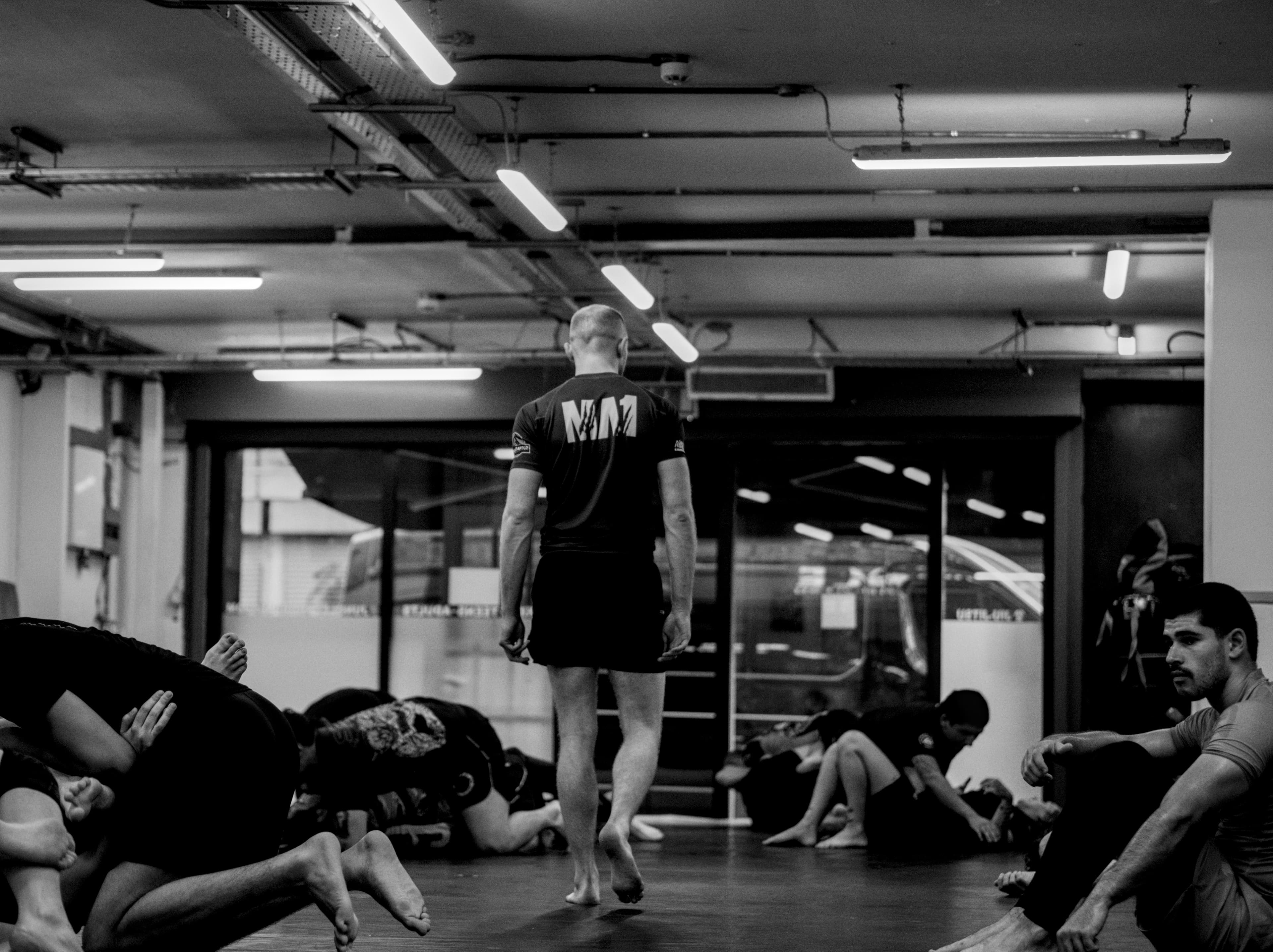 Brazilian Jiu-Jitsu athletes training on the mat